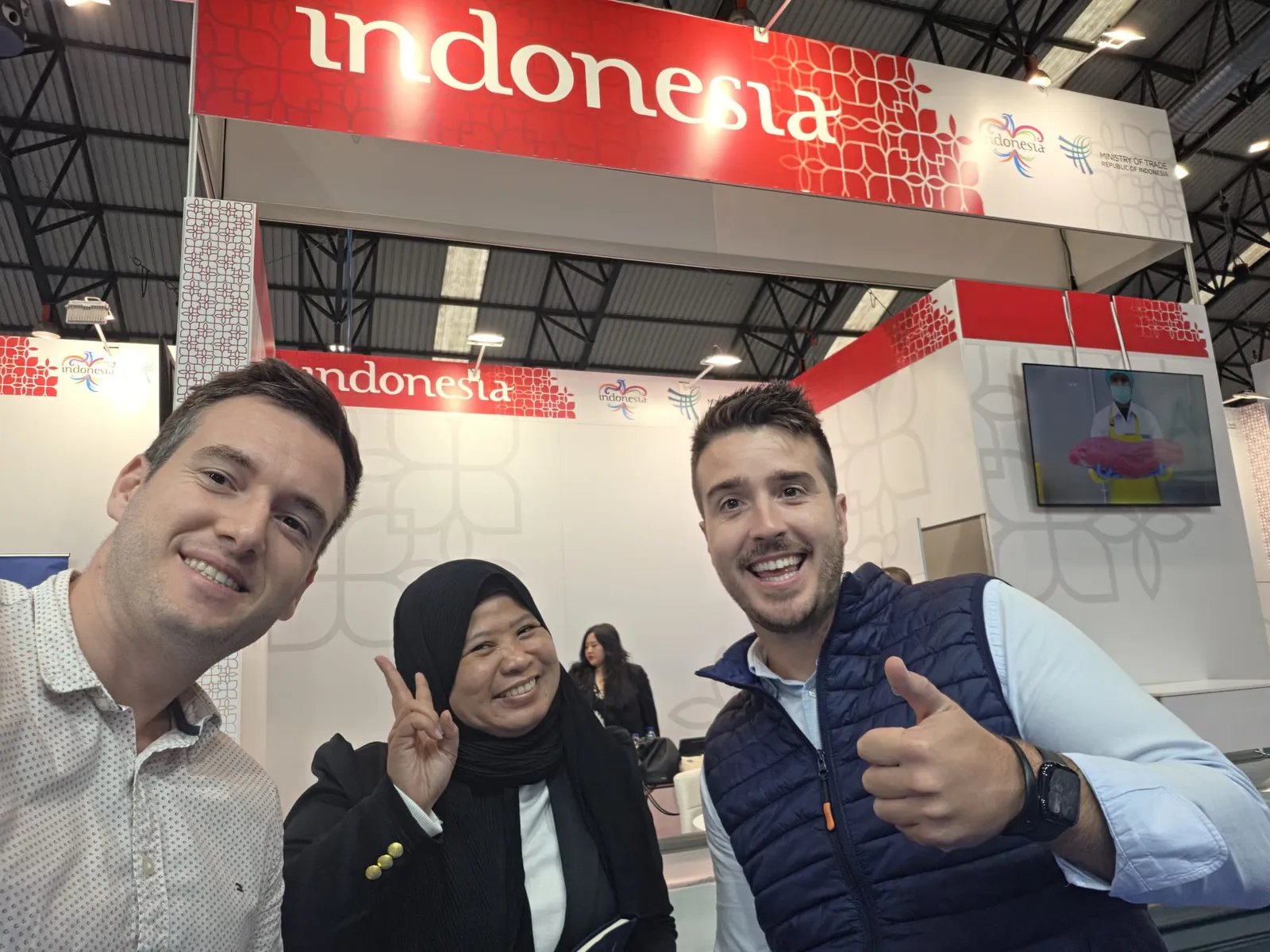 Two of the FrozenFish team with an Indonesian exhibitor on the pavilion